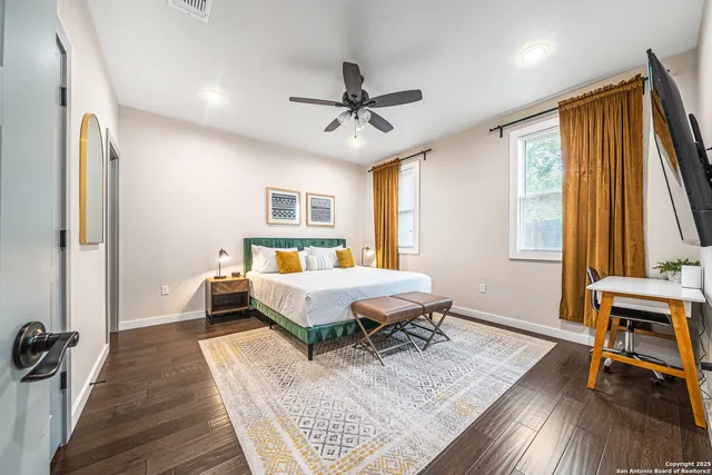 a living room with a bed furniture and a window