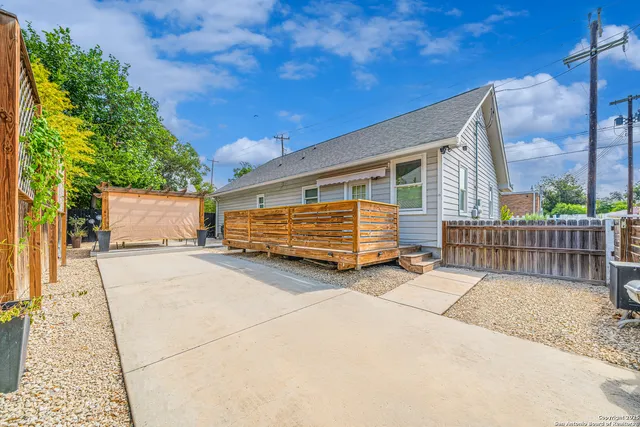 a view of backyard with deck
