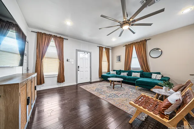 a living room with furniture and a large window