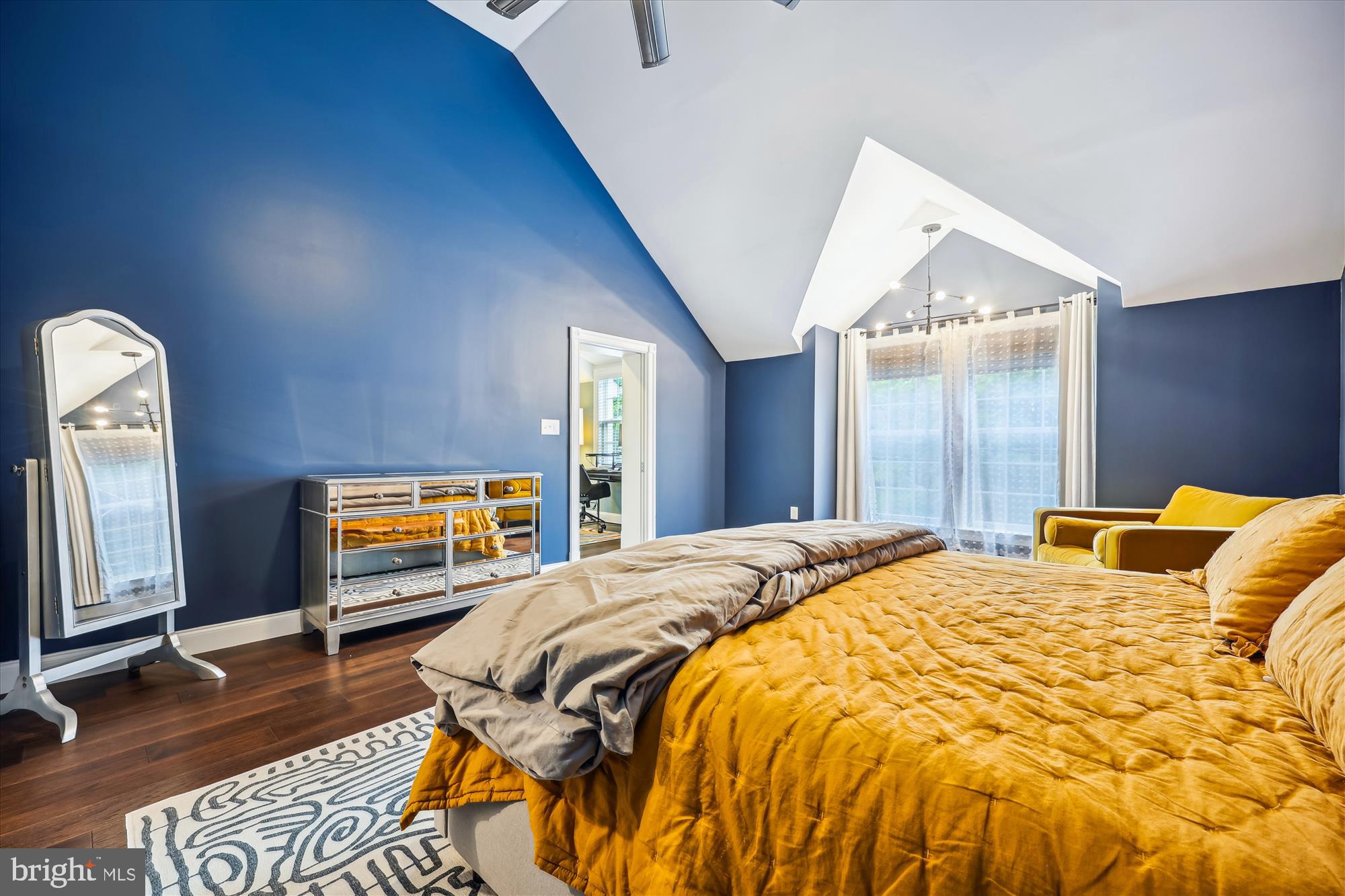 8103 Piney Branch Road Silver Spring, MD 20910 - Photo 20 of 42 a bedroom with a bed and a large mirror next to a window