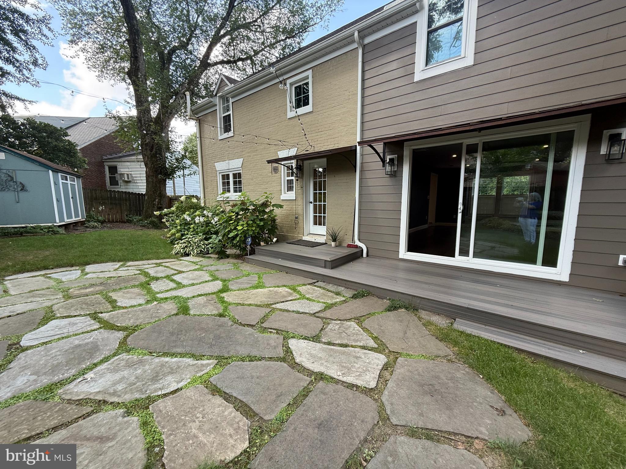 8103 Piney Branch Road Silver Spring, MD 20910 - Photo 35 of 42 a front view of a house with a yard