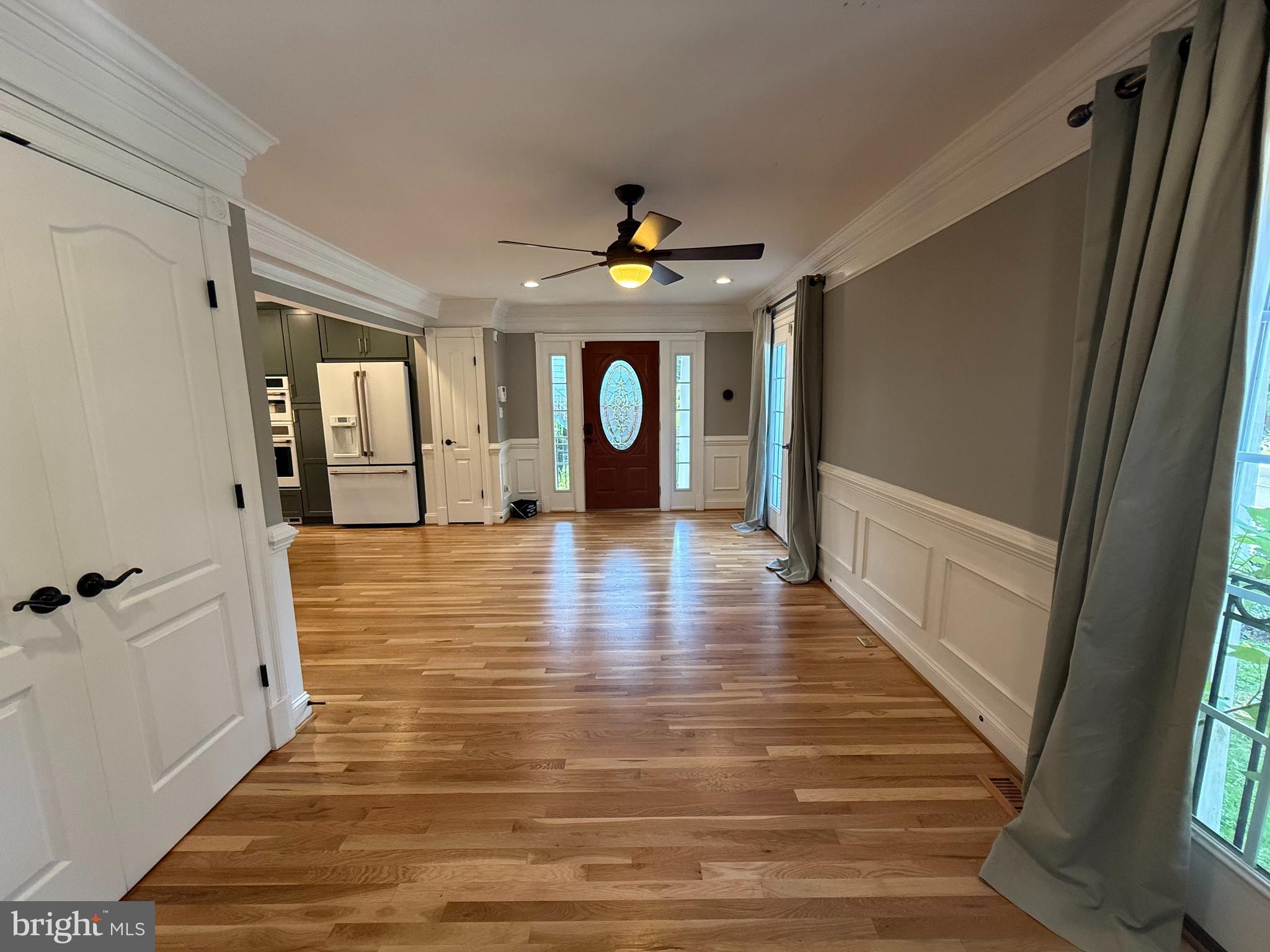 8103 Piney Branch Road Silver Spring, MD 20910 - Photo 4 of 42 a view of a hallway view with wooden floor and staircase