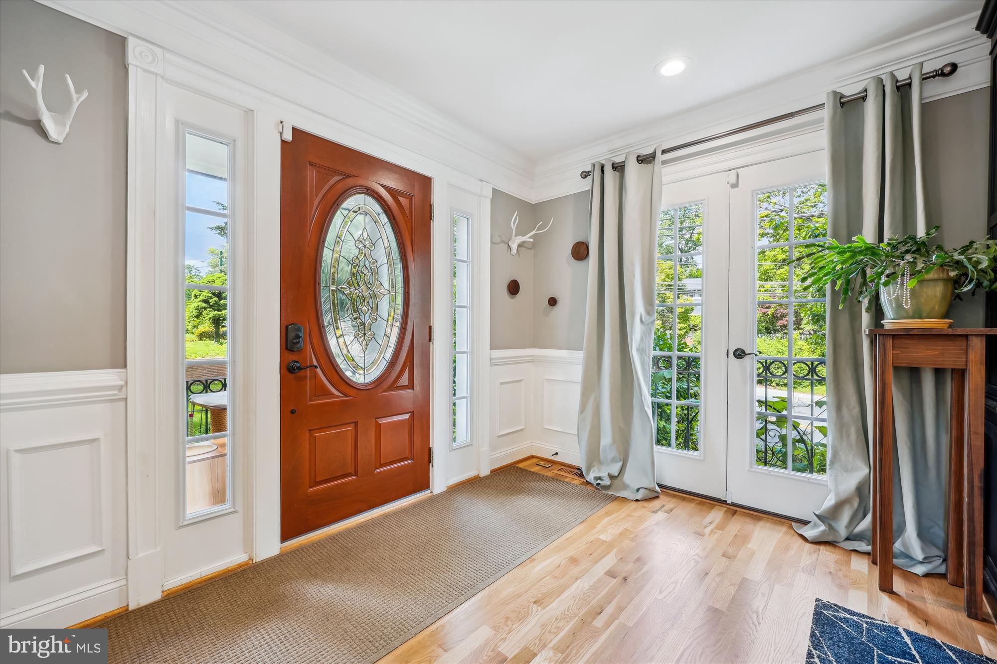 8103 Piney Branch Road Silver Spring, MD 20910 - Photo 37 of 42 a view of a hallway with entryway and wooden floor