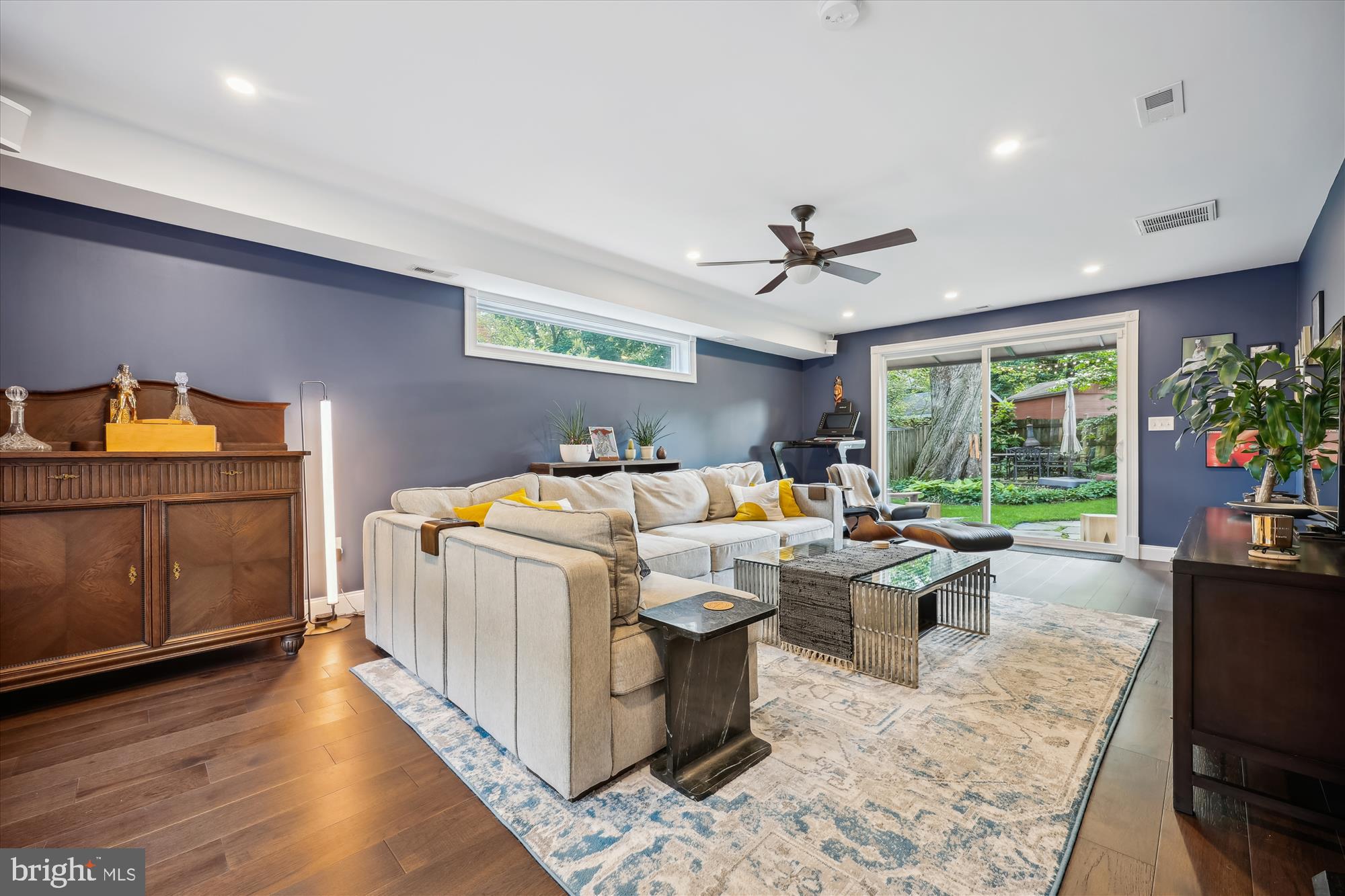 8103 Piney Branch Road Silver Spring, MD 20910 - Photo 10 of 42 a bed room with a bed a couch and a chandelier