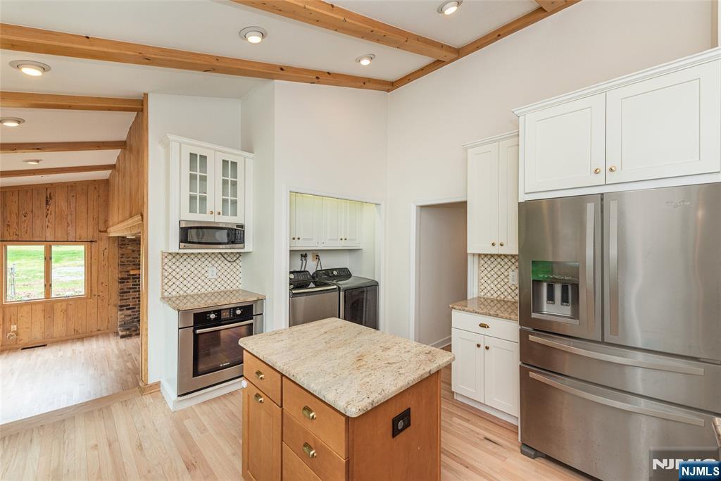 163 Sand Spring Road Morristown, NJ 07960 - Photo 9 of 39 a kitchen with a refrigerator stove and sink