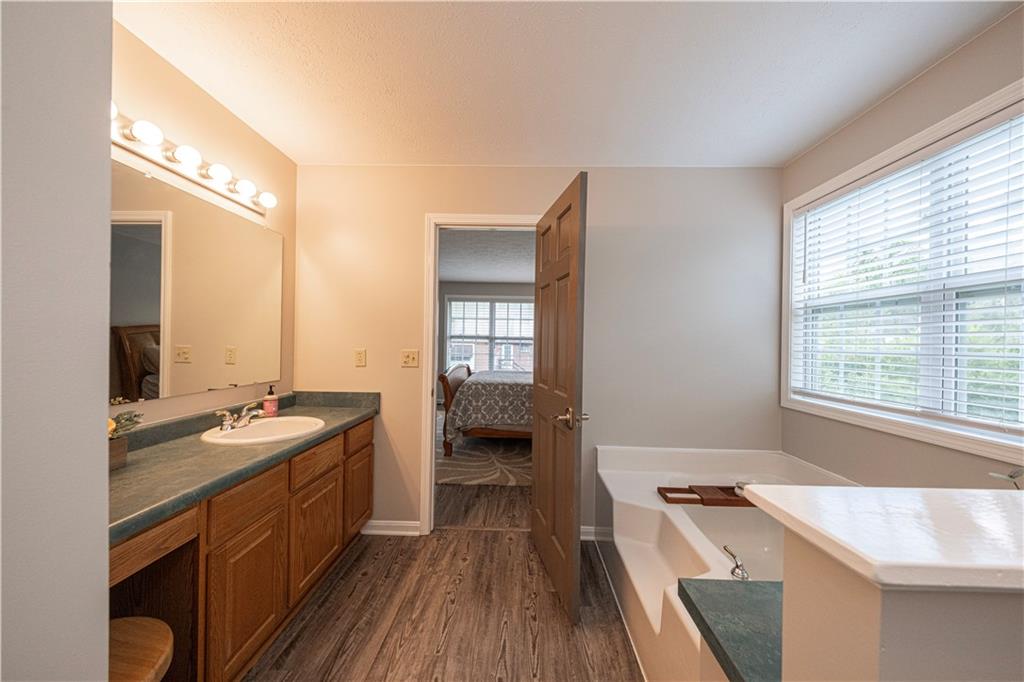 435 Cottage Lane Monroeville, PA 15146 - Photo 25 of 46 Private en-suite bath features a relaxing soaking tub, separate shower, and ample space for everyday comfort.
