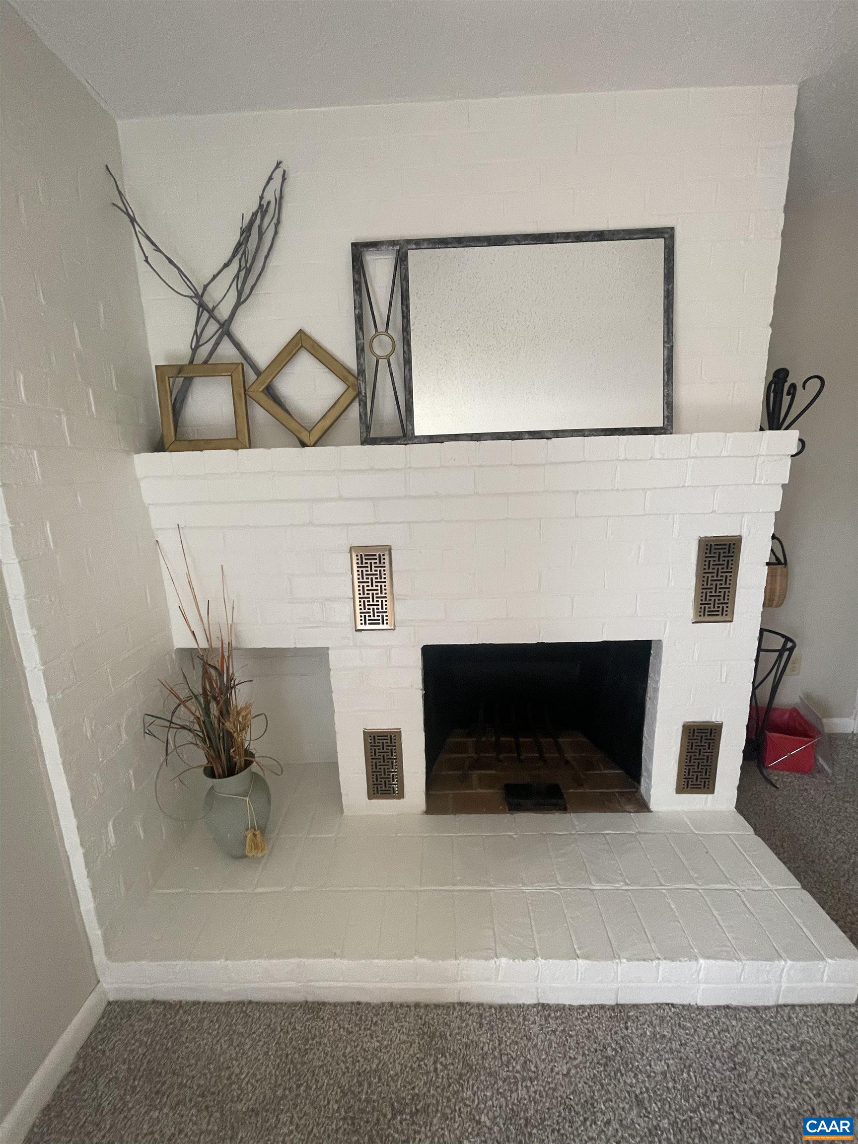 115 Turtle Creek Road, Unit 8 Charlottesville, VA 22901 - Photo 18 of 40 a living room with furniture and a fireplace