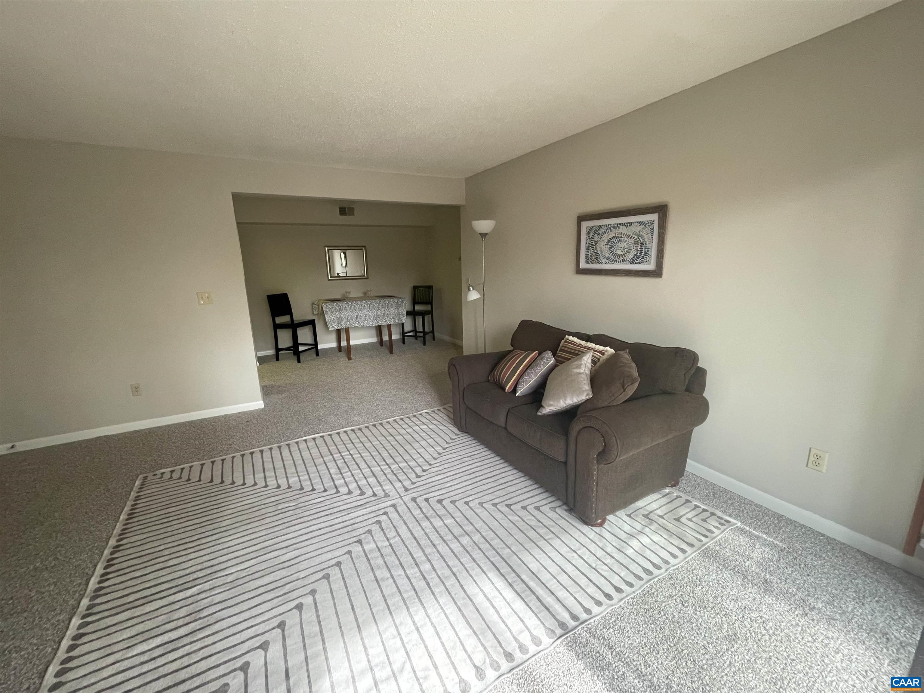 115 Turtle Creek Road, Unit 8 Charlottesville, VA 22901 - Photo 19 of 40 a living room with furniture and a table