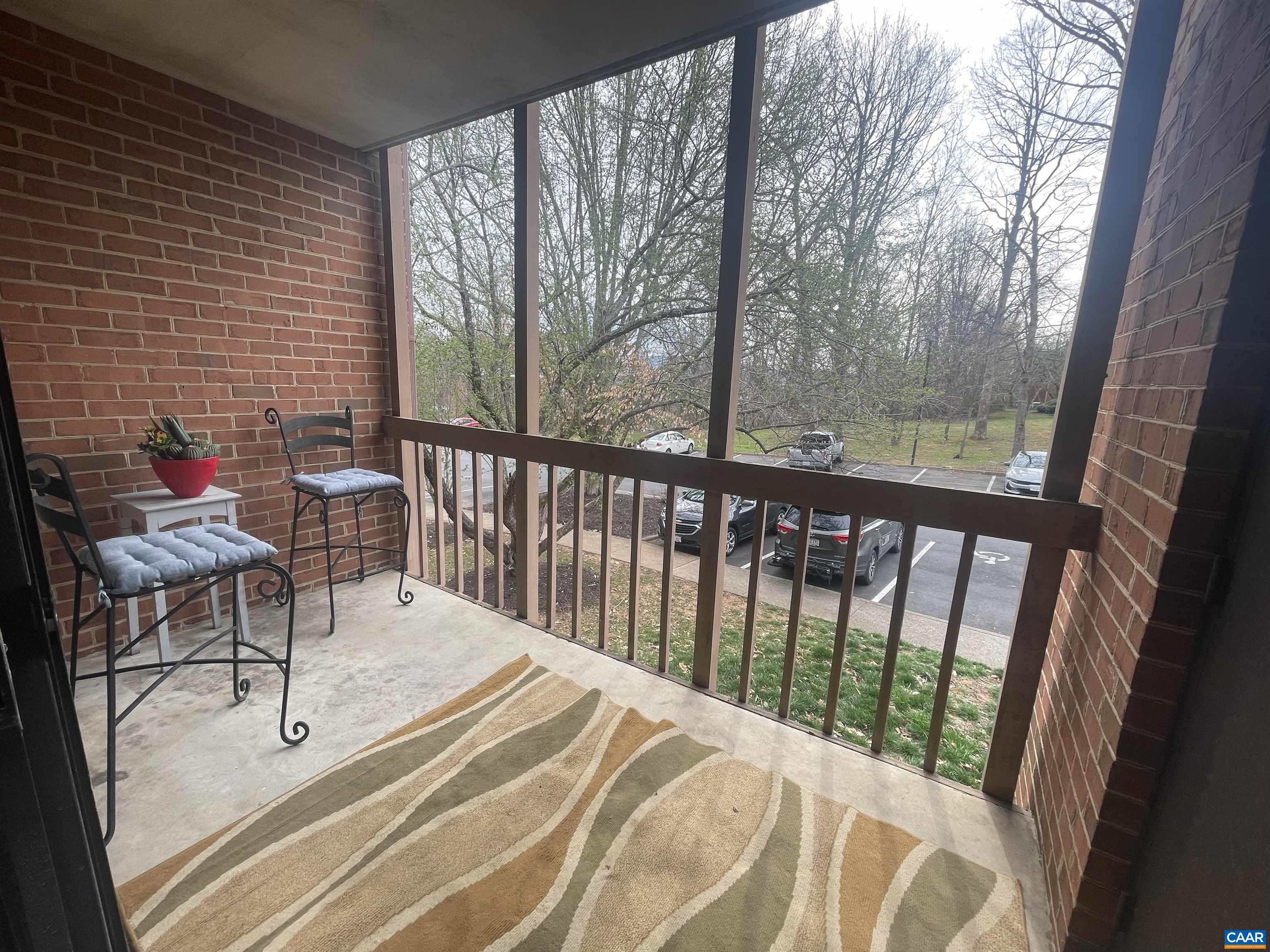 115 Turtle Creek Road, Unit 8 Charlottesville, VA 22901 - Photo 2 of 40 a view of a two chairs in the balcony