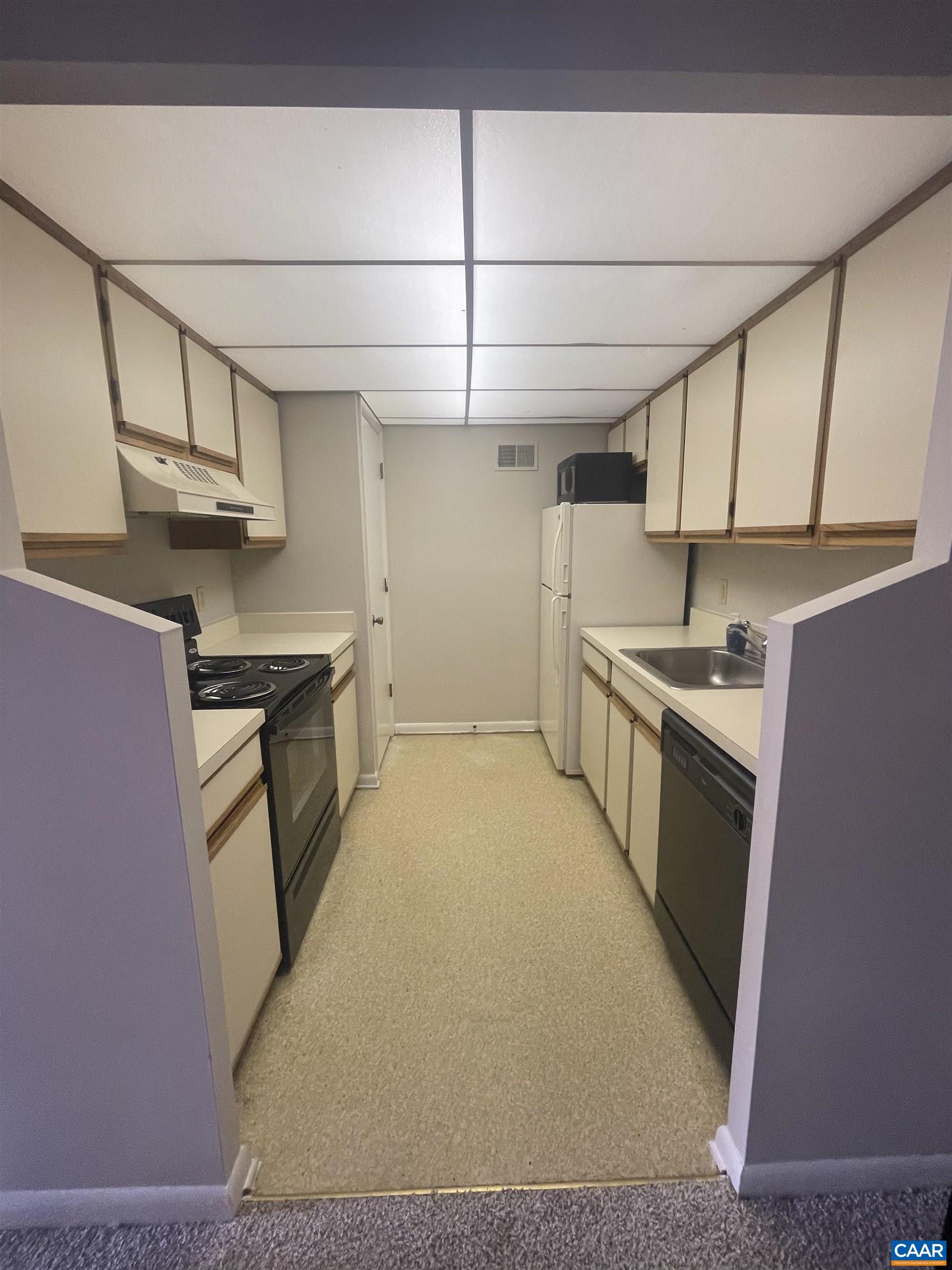 115 Turtle Creek Road, Unit 8 Charlottesville, VA 22901 - Photo 23 of 40 a kitchen with stainless steel appliances a sink stove and cabinets