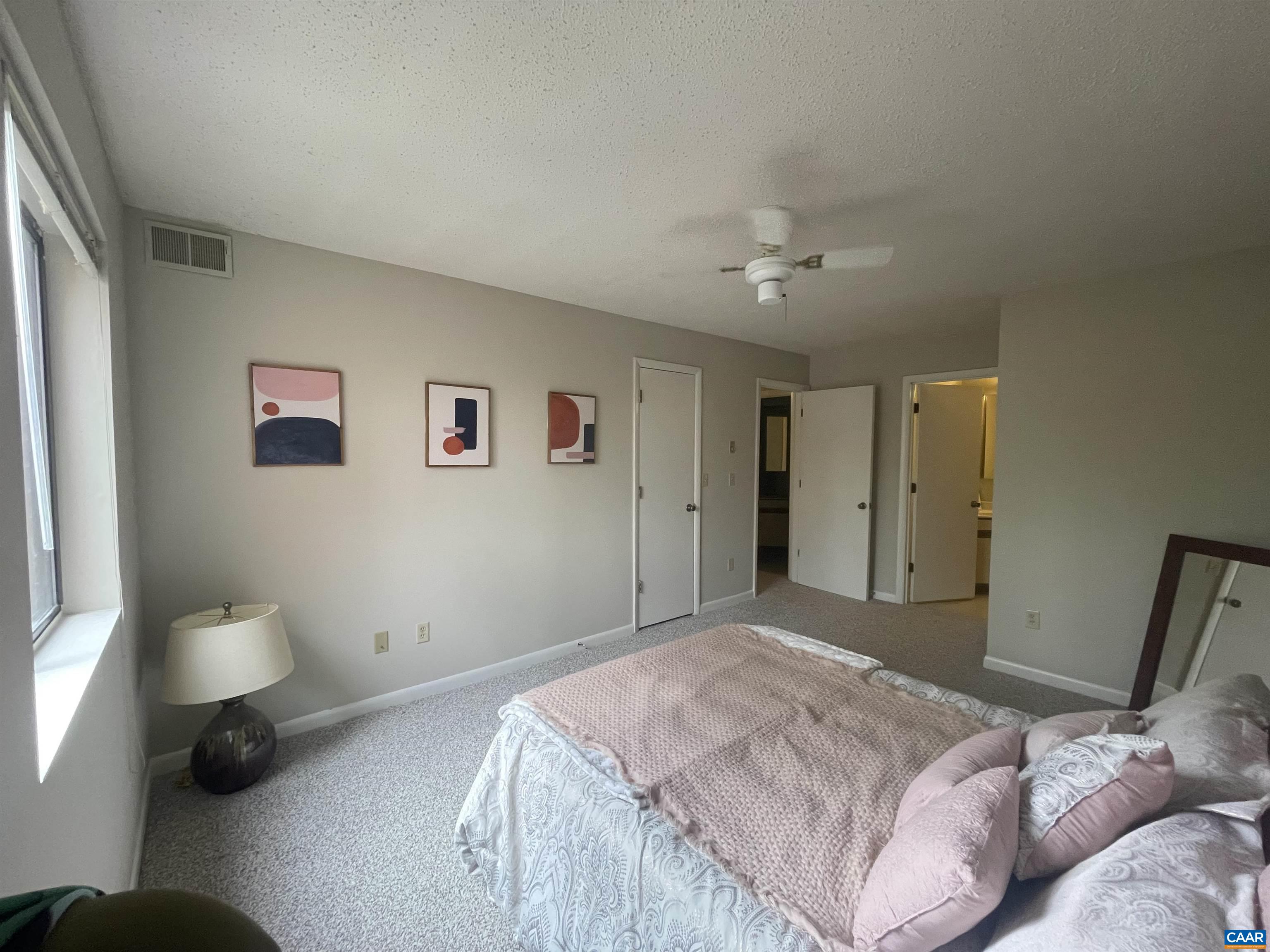 115 Turtle Creek Road, Unit 8 Charlottesville, VA 22901 - Photo 31 of 40 a bedroom with a bed and a couch