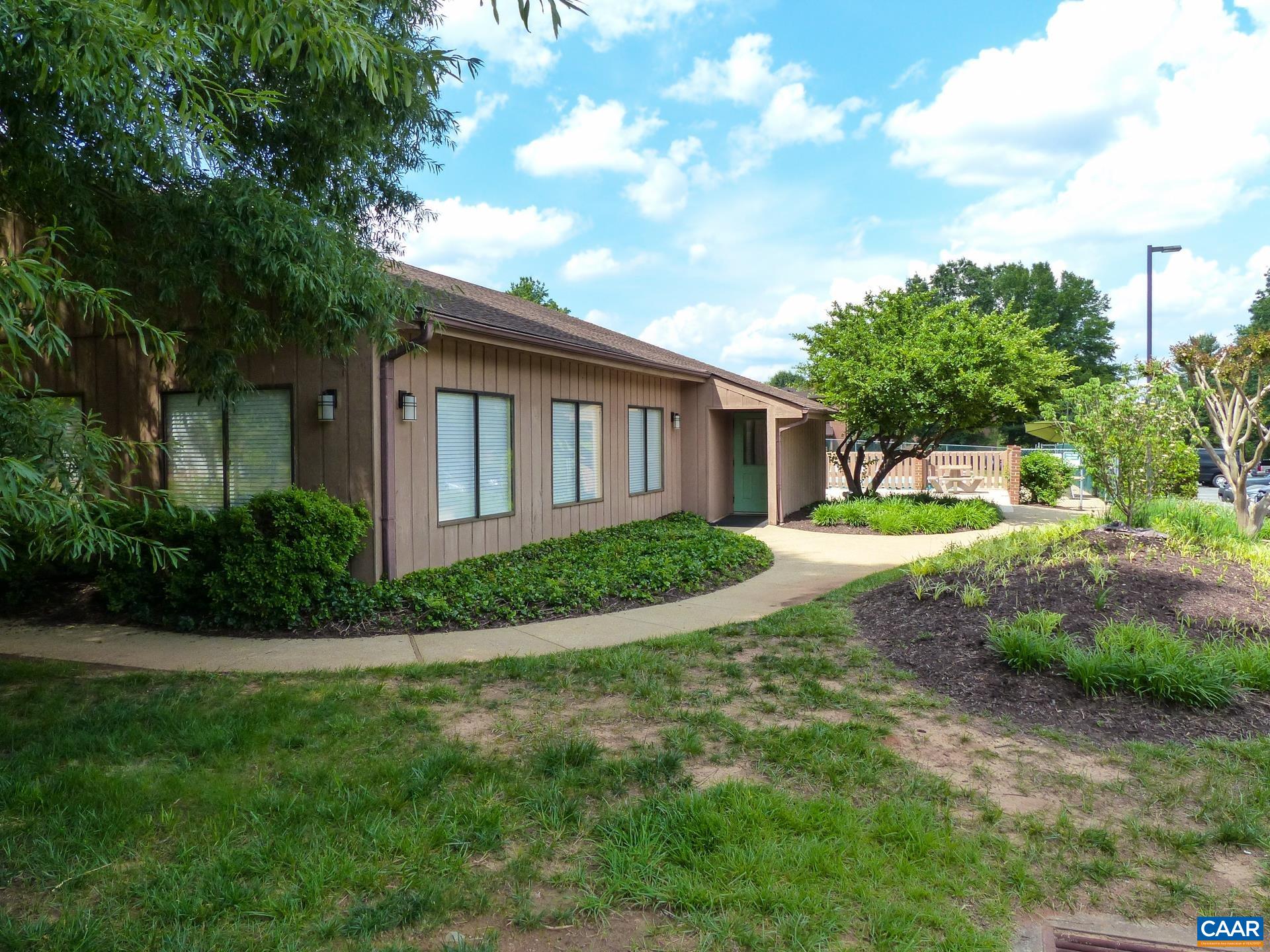 115 Turtle Creek Road, Unit 8 Charlottesville, VA 22901 - Photo 7 of 40 a view of a house with a big yard plants and large trees
