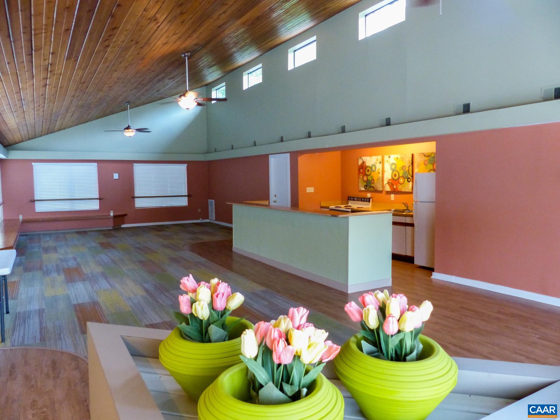 115 Turtle Creek Road, Unit 8 Charlottesville, VA 22901 - Photo 8 of 40 a vase of flowers sitting on a wooden floor