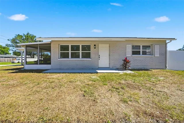 a front view of house with yard and seating space