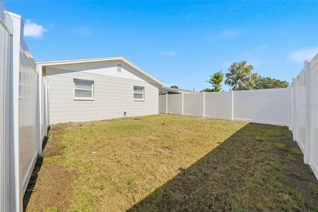 a house view with a backyard space