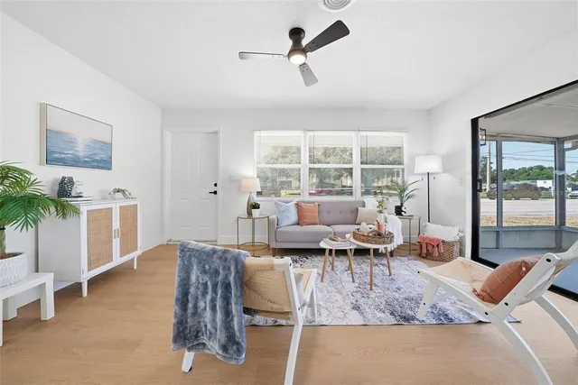 a living room with furniture and a large window