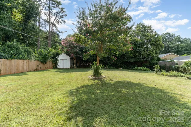 a swimming pool with wooden fence
