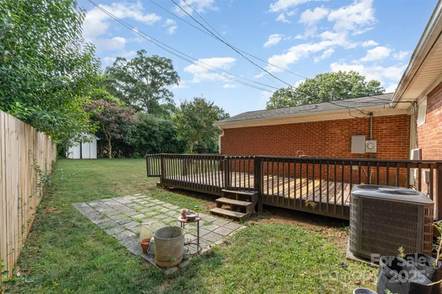 a view of a deck with a small yard