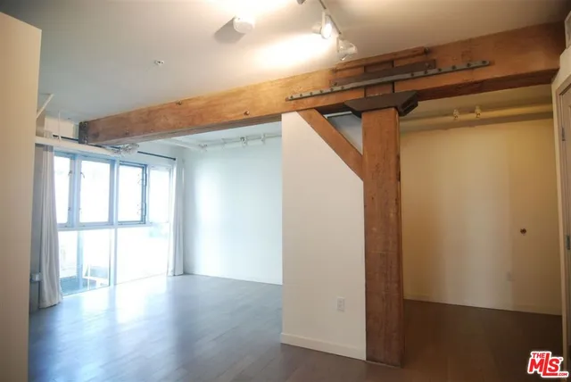 a view of a hallway with a kitchen