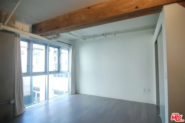 a bathroom with a sink toilet a mirror and shower