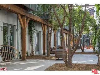 a room with lots of chairs and mirrors