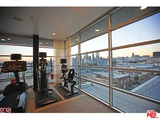 a outdoor space with patio the couches and a dining table and chairs with an umbrella