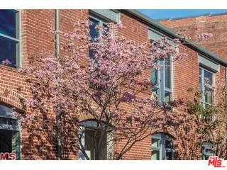a room with gym equipment and a flat screen tv