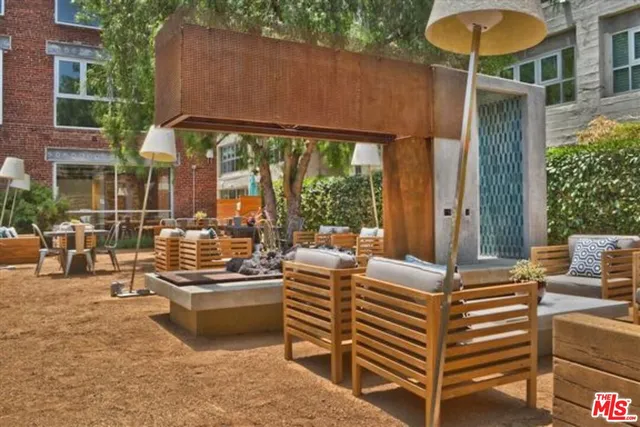 a view of a swimming pool outdoor seating and city view