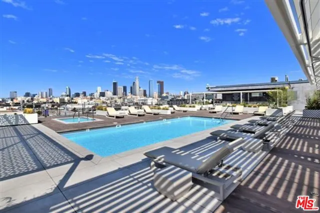 an outdoor sitting area with a lake view