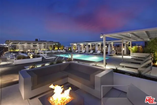 a view of a patio with couches table and chairs