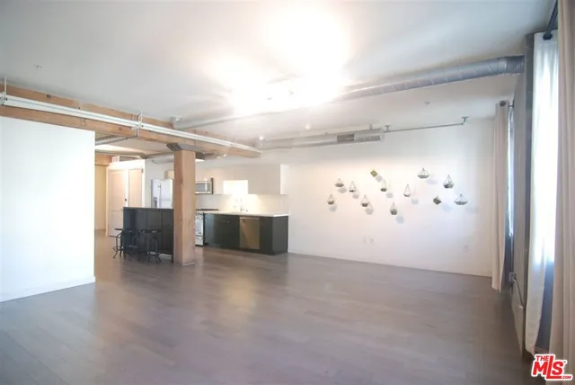 a view of a hallway with wooden shelves