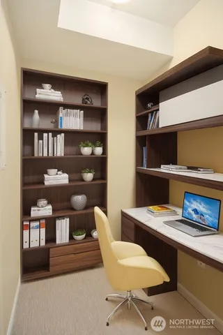 a view of a workspace with furniture