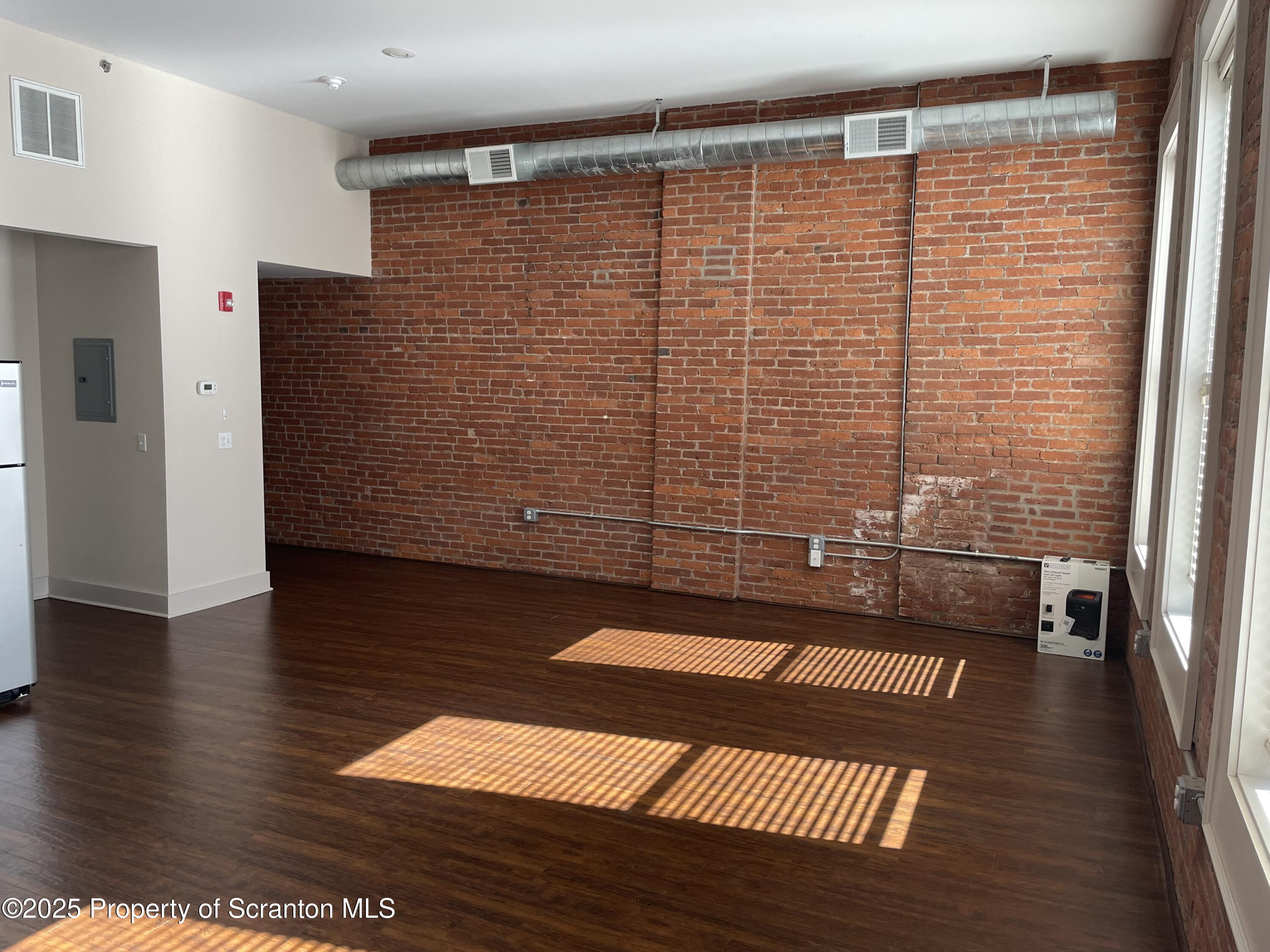 320 Penn Avenue, Unit 2 Scranton, PA 18503 - Photo 2 of 6 a view of a hall with wooden floor
