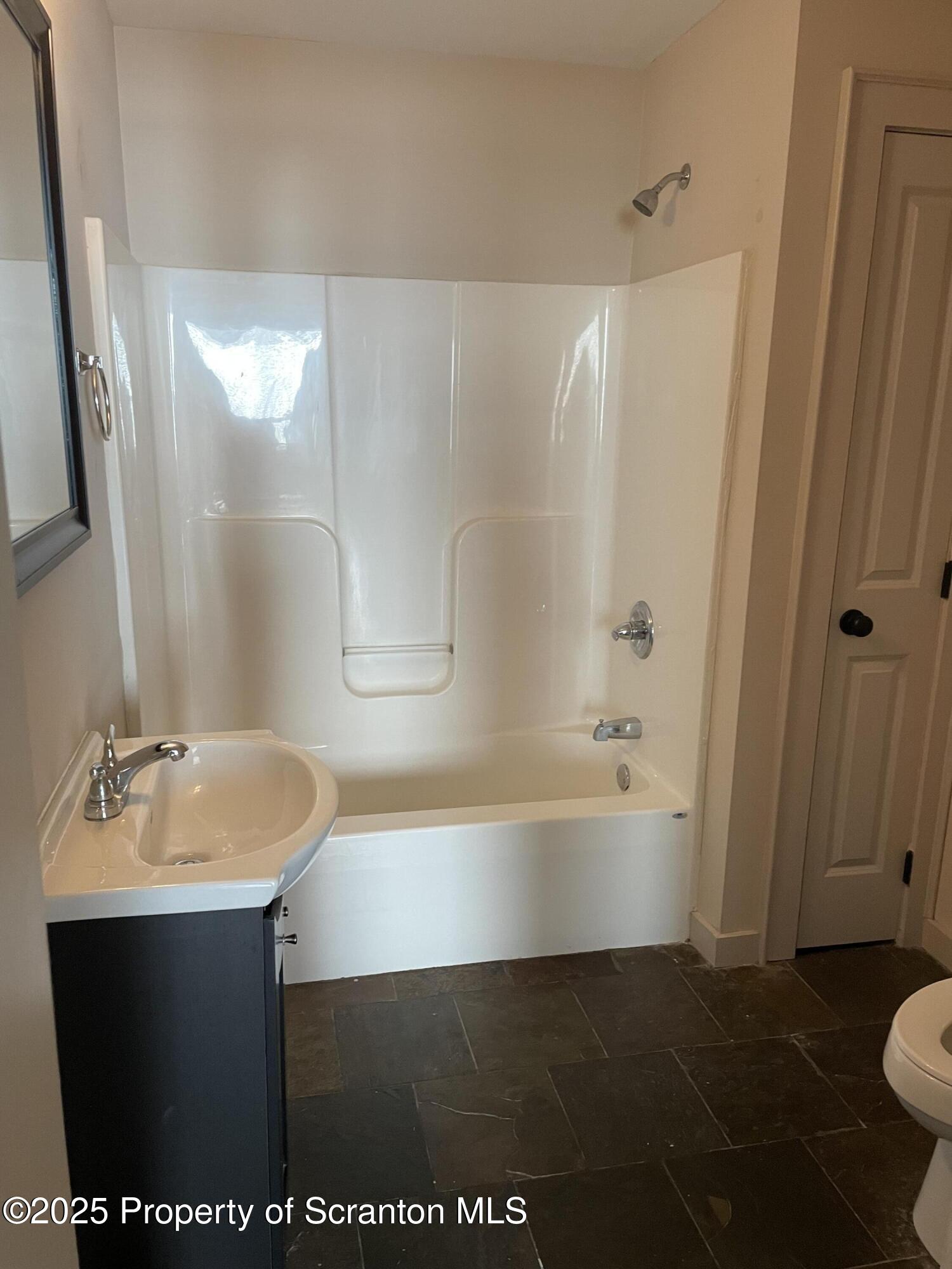 320 Penn Avenue, Unit 2 Scranton, PA 18503 - Photo 4 of 6 a bathroom with a sink and a mirror