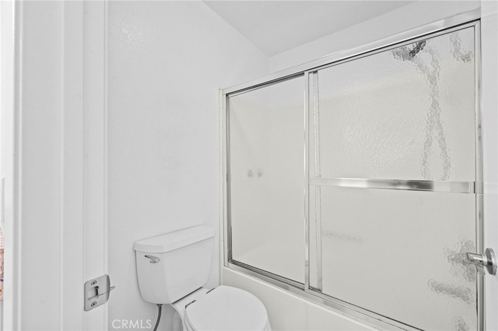 215 South Cross Creek Road, Unit L Orange, CA 92869 - Photo 28 of 50 a bathroom that has a shower toilet and sink