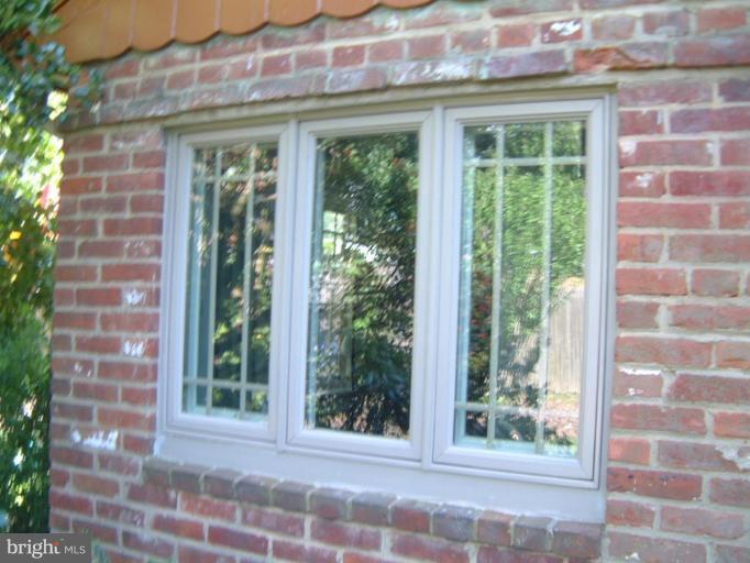 2002 Plyers Mill Road Silver Spring, MD 20902 - Photo 21 of 29 a view of a brick building next to a yard