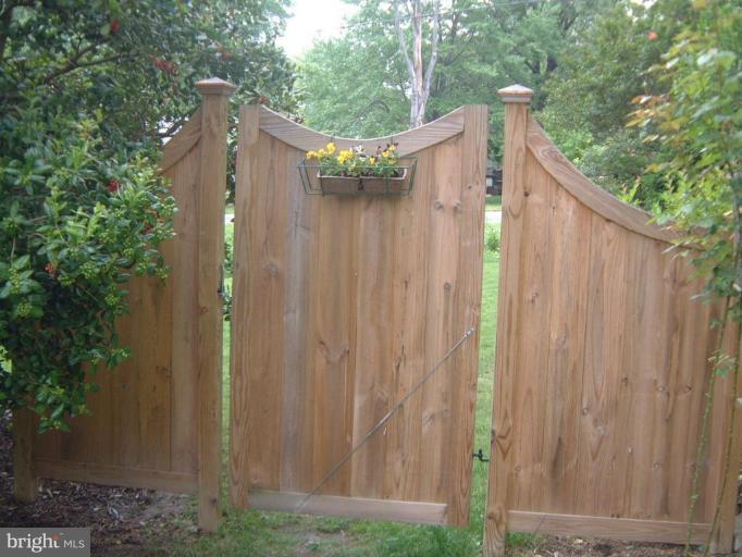 2002 Plyers Mill Road Silver Spring, MD 20902 - Photo 29 of 29 a view of a small house with a wooden fence
