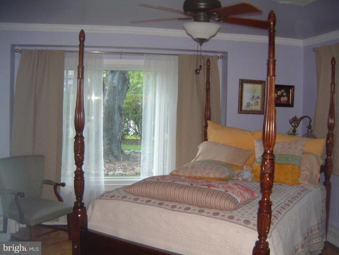 2002 Plyers Mill Road Silver Spring, MD 20902 - Photo 8 of 29 a bedroom with a large bed and a window