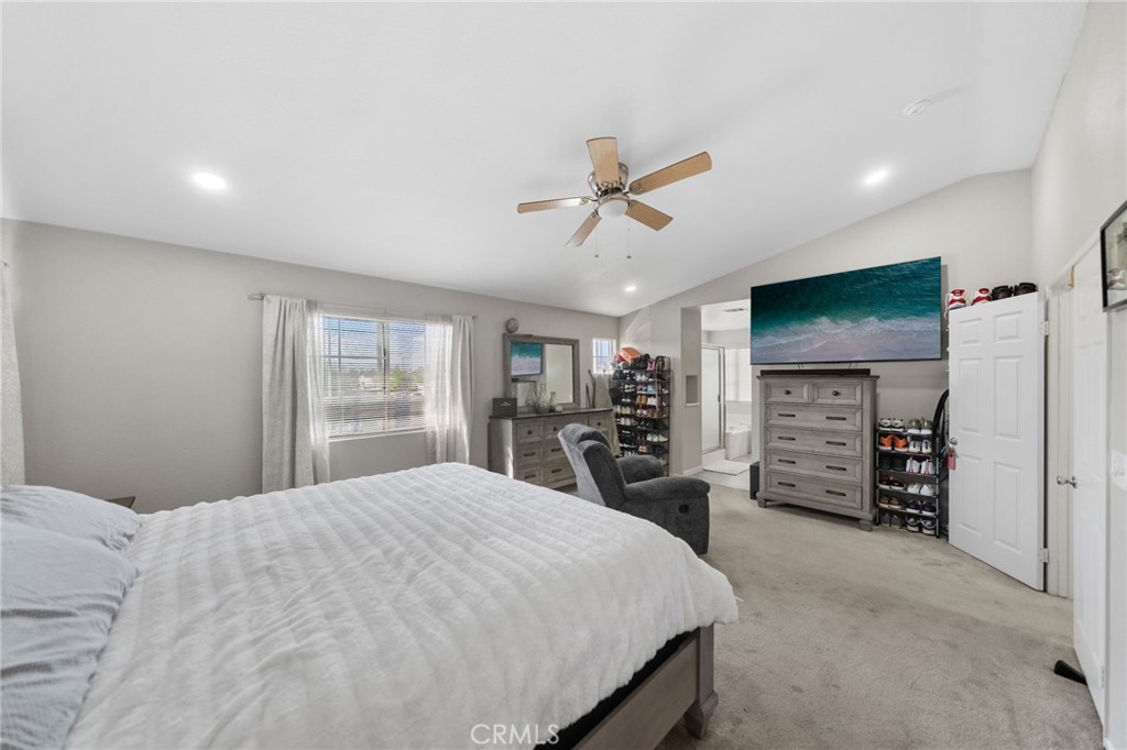 1494 Rabbit Peak Way Hemet, CA 92545 - Photo 25 of 45 a large bedroom with a bed and a flat screen tv
