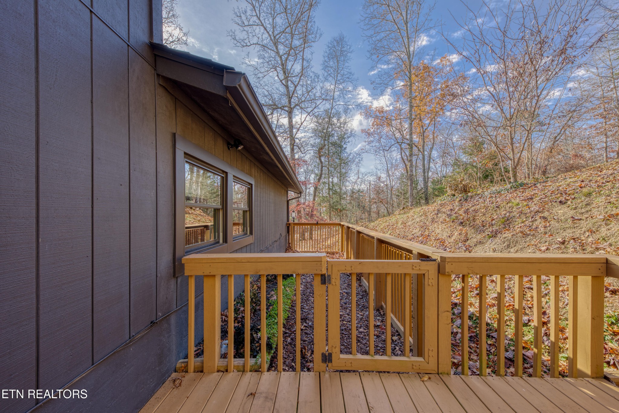 333 Enchanted Forest Way Sevierville, TN 37876 - Photo 31 of 42 a front view of a house with wooden stairs and deck