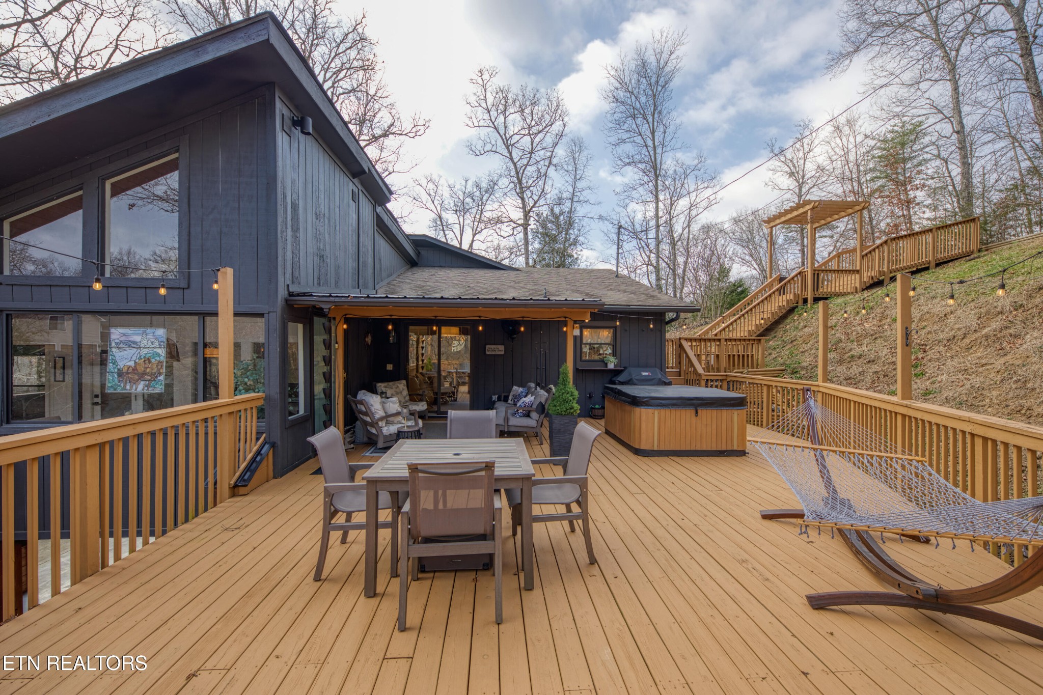 333 Enchanted Forest Way Sevierville, TN 37876 - Photo 33 of 42 a view of a house with wooden deck and furniture