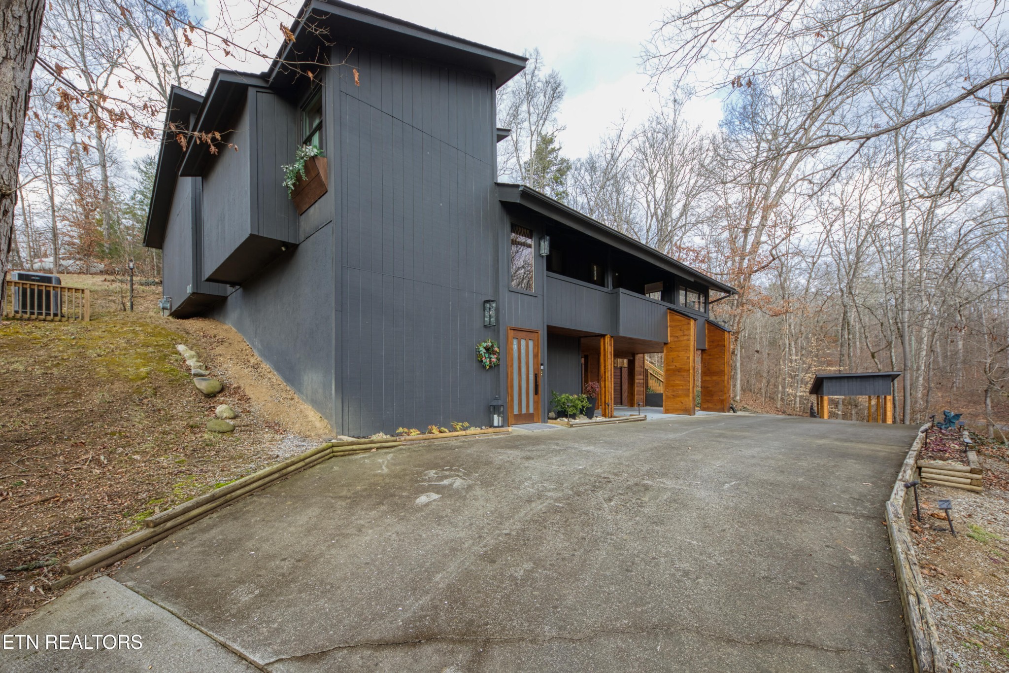 333 Enchanted Forest Way Sevierville, TN 37876 - Photo 35 of 42 a tall building with trees in front of it