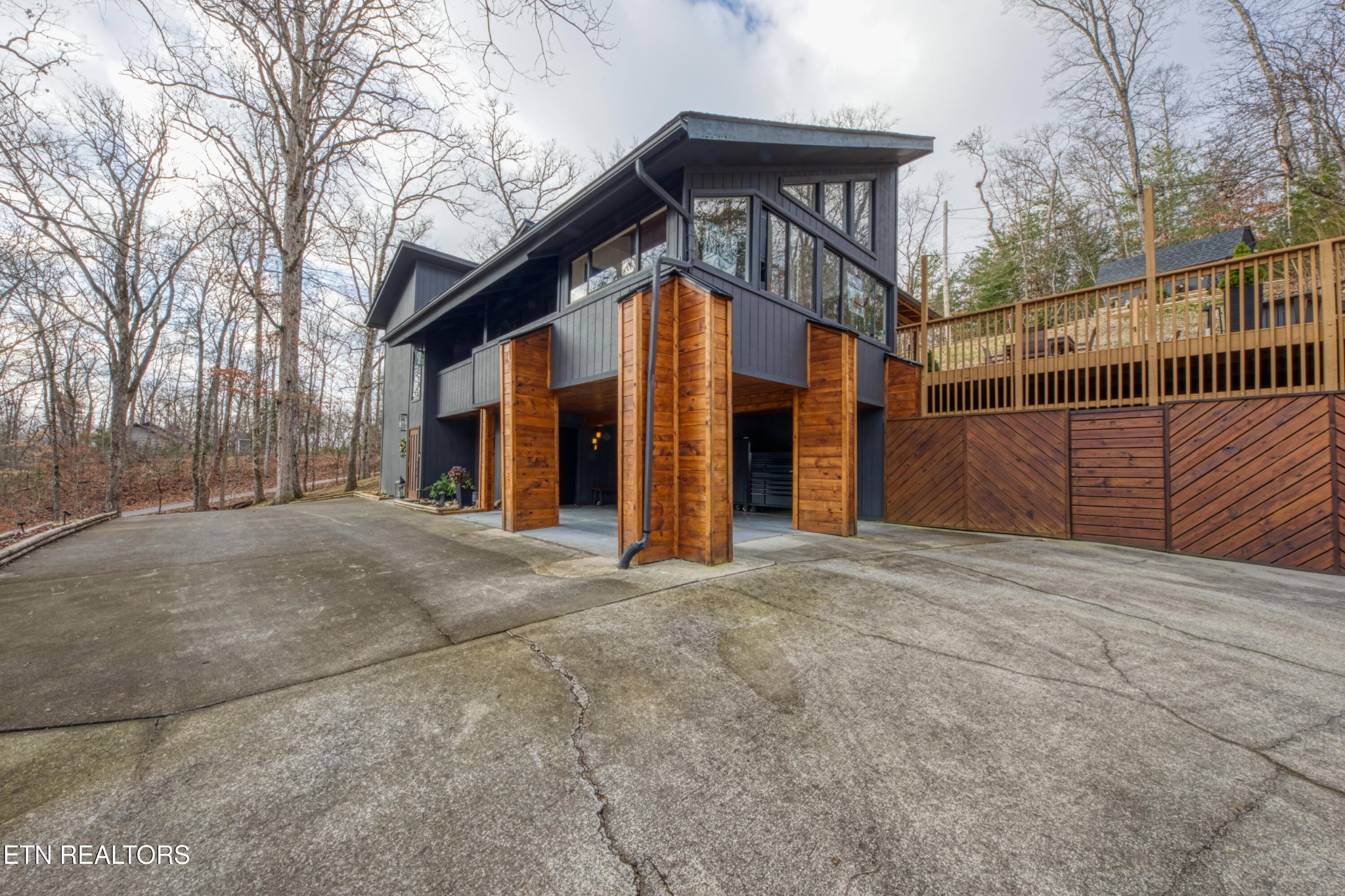 333 Enchanted Forest Way Sevierville, TN 37876 - Photo 39 of 42 a view of a house with a wooden fence and large trees