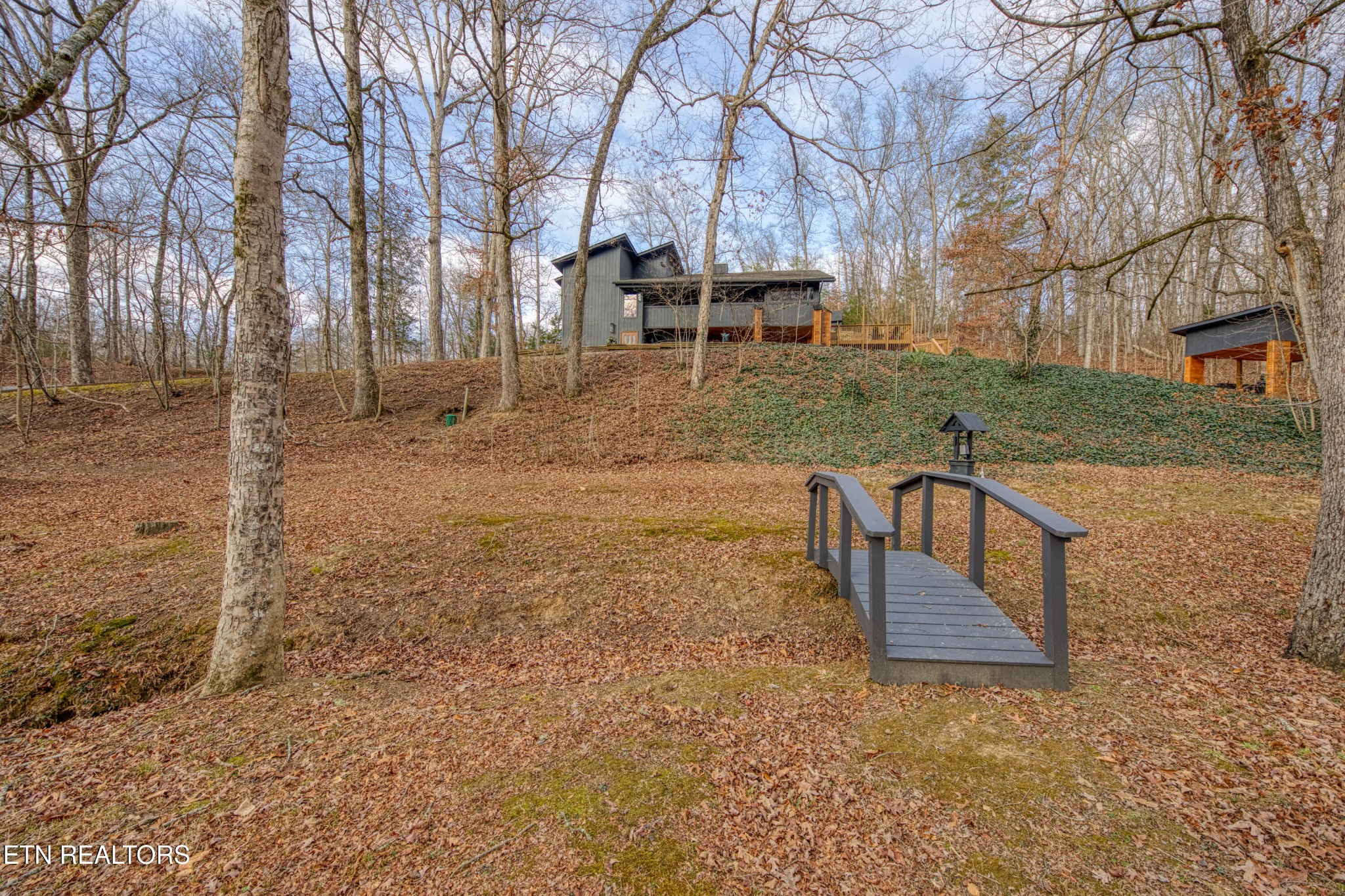 333 Enchanted Forest Way Sevierville, TN 37876 - Photo 42 of 42 a view of a bench in the middle of a yard