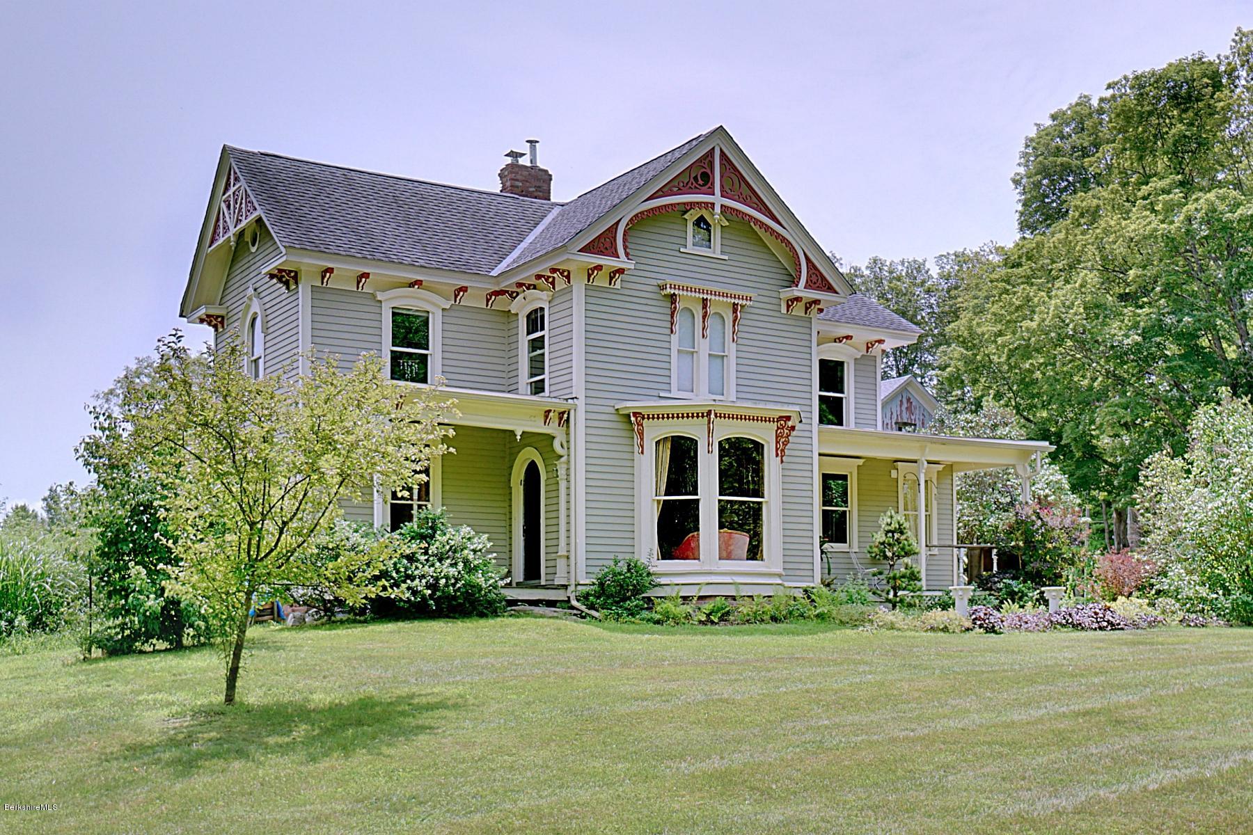 200 Main Road Monterey, MA 01245 - Photo 1 of 30 a front view of a house with a yard