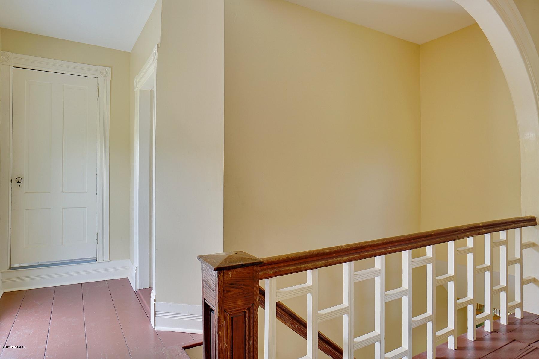 200 Main Road Monterey, MA 01245 - Photo 17 of 30 a view of staircase with railing and a wooden floor