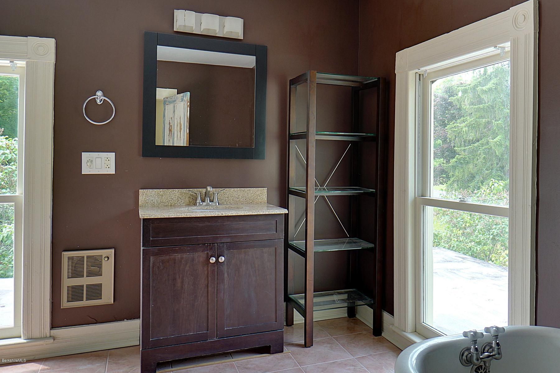 200 Main Road Monterey, MA 01245 - Photo 21 of 30 a room with a sink and a mirror