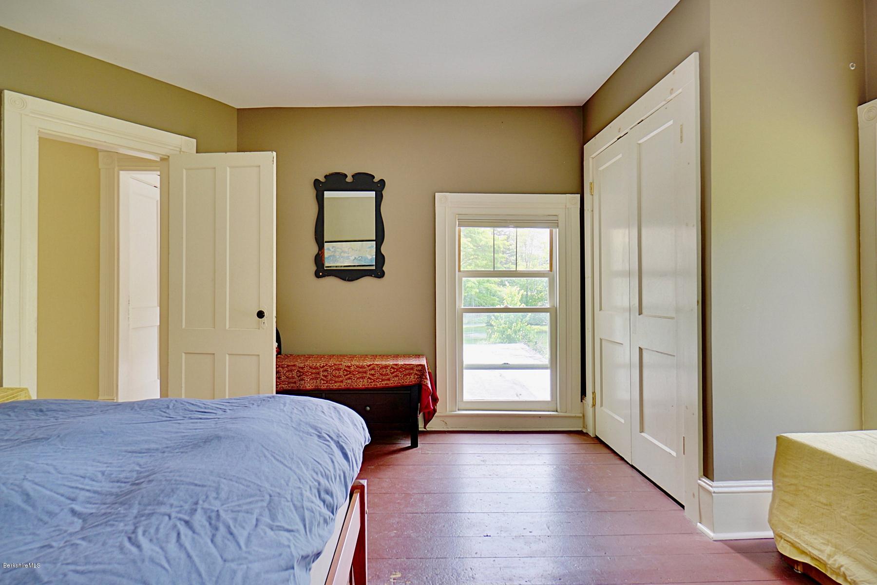 200 Main Road Monterey, MA 01245 - Photo 23 of 30 a bedroom with a bed and a window