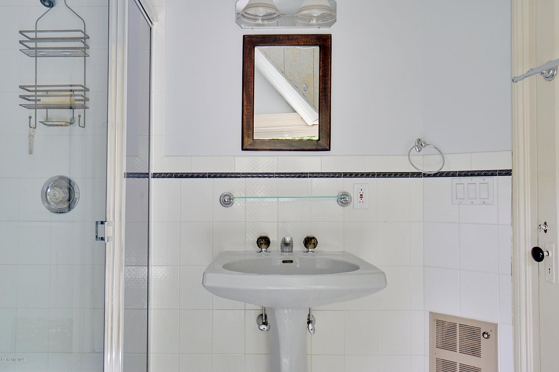 200 Main Road Monterey, MA 01245 - Photo 24 of 30 a bathroom with a sink and mirror