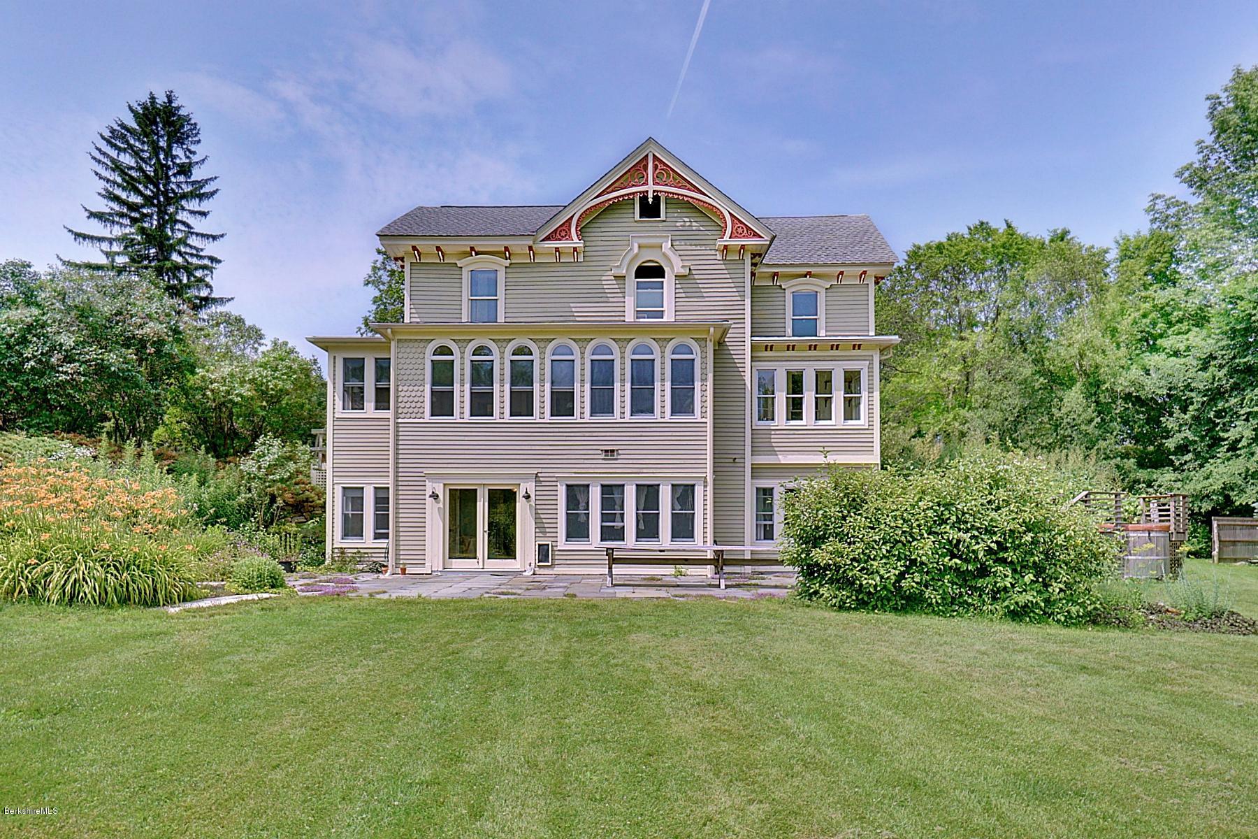 200 Main Road Monterey, MA 01245 - Photo 5 of 30 a front view of a house with a garden